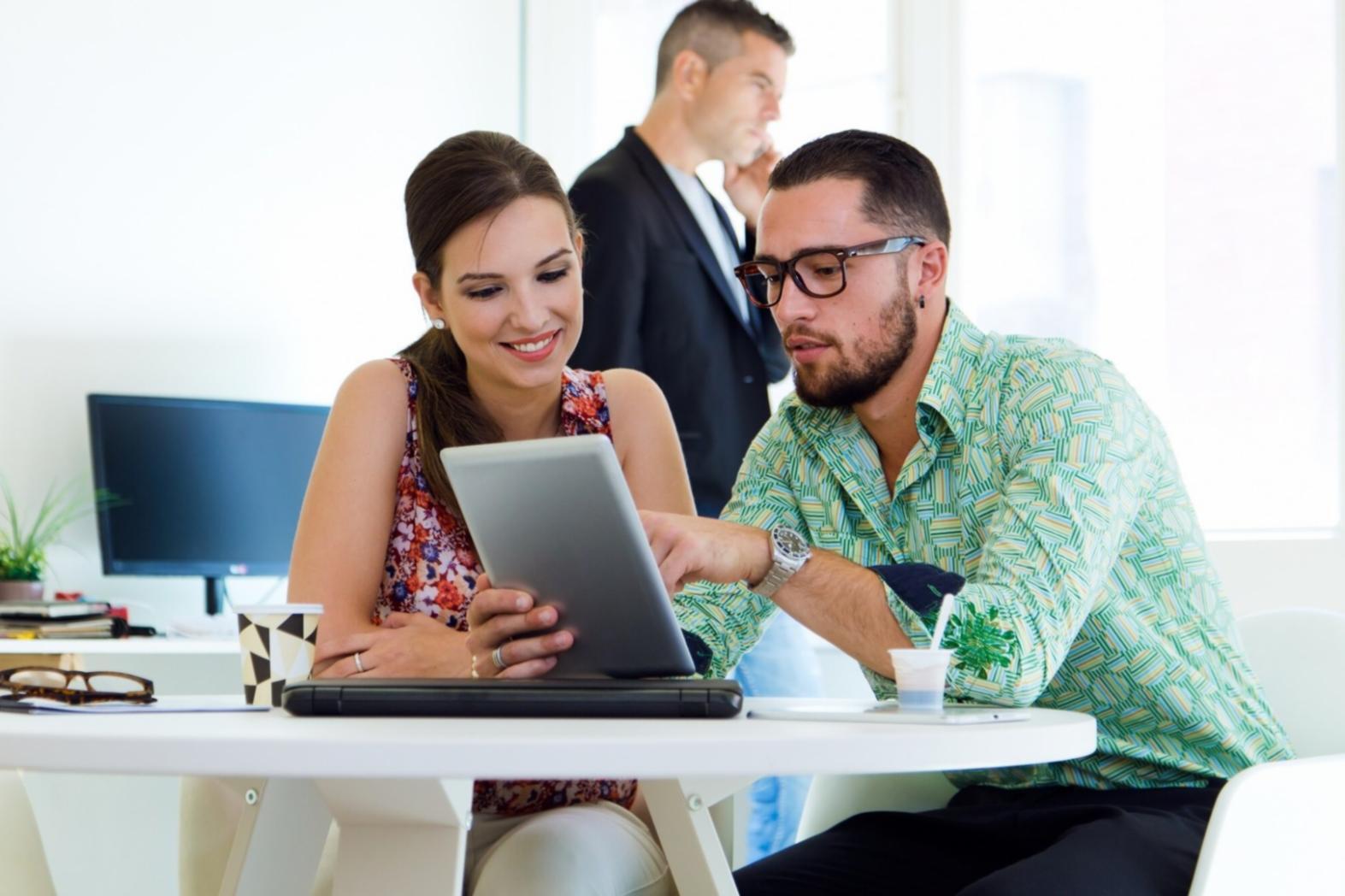 Collaborative business strategy session with financial planning documents